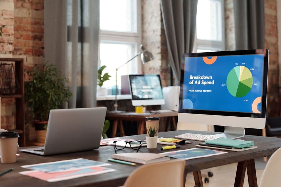 Agency desk with a marketing analytics dashboard