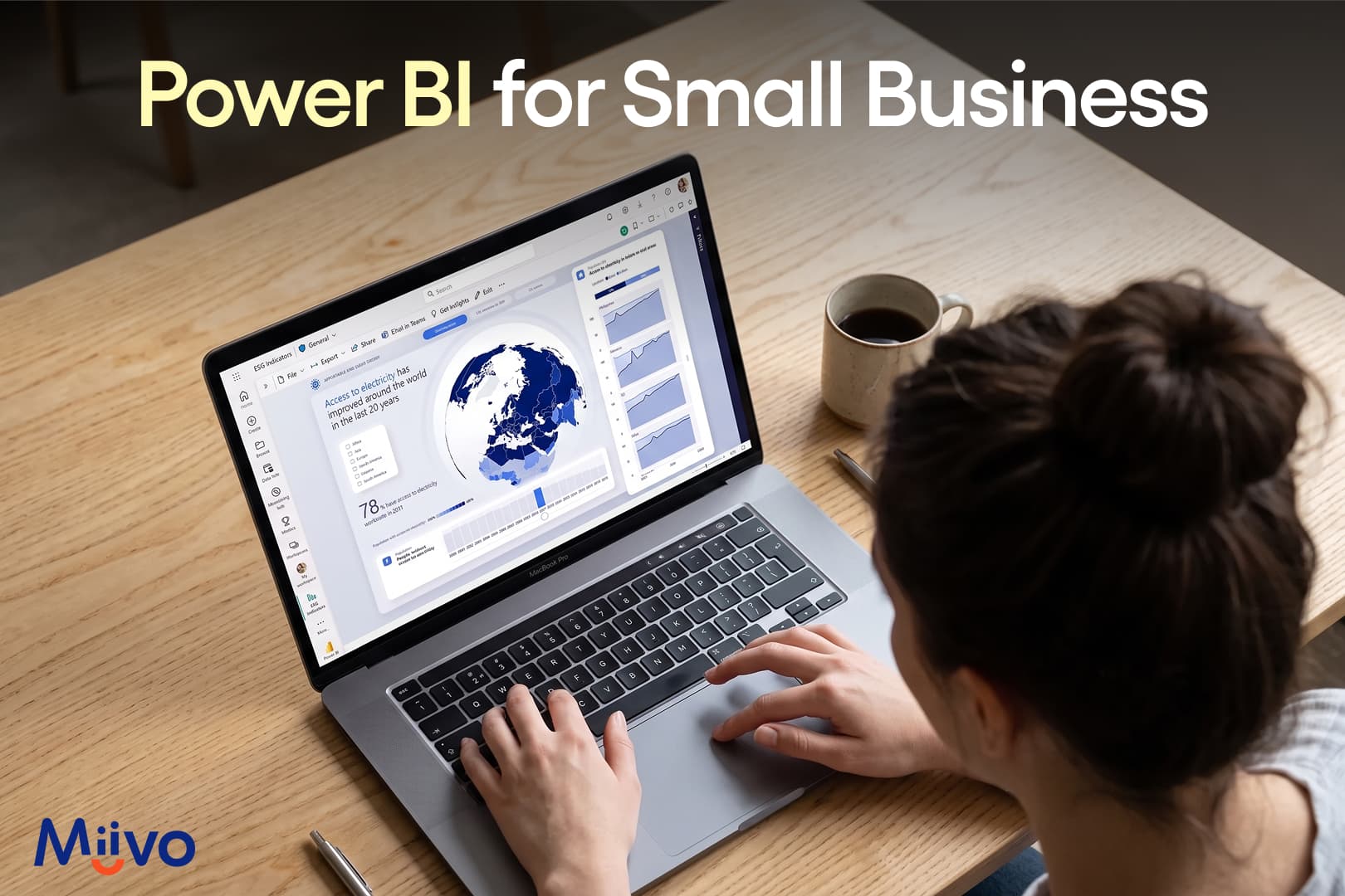 Womon looking at power BI options on laptop